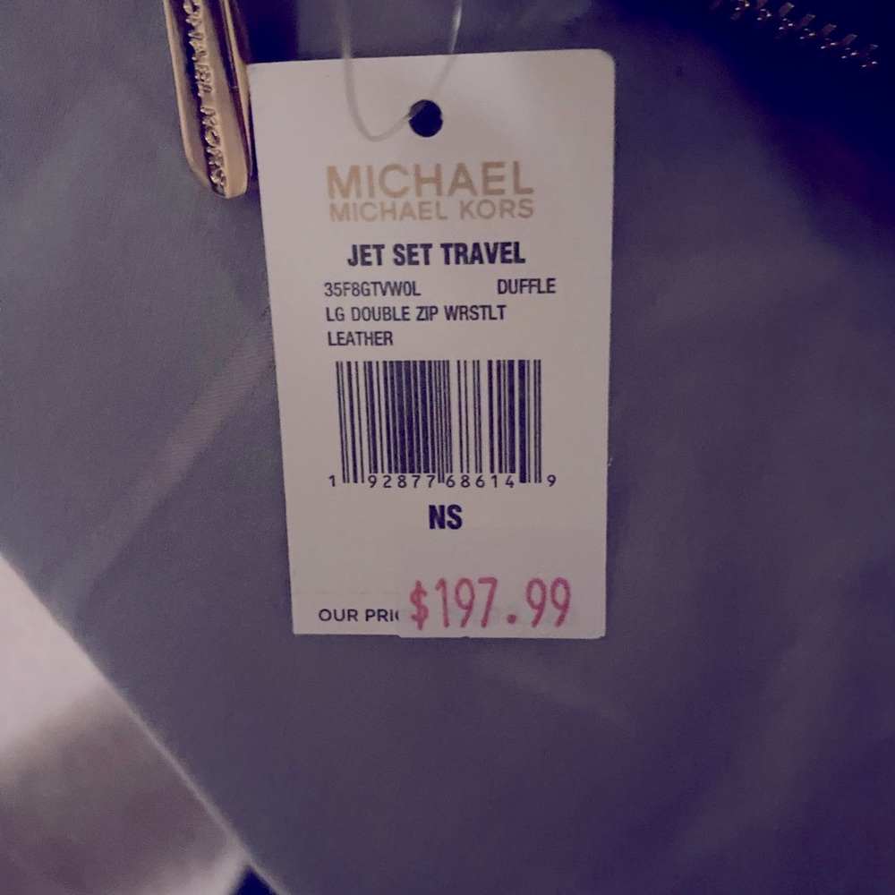 Michael kohrs crossbody and matching wallet..